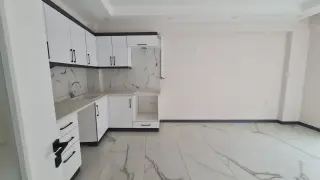 Burhaniye Kocacami Mahallesinde Satılık 1+1 Modern Daire