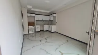 Burhaniye Kocacami Mahallesinde Satılık 1+1 Modern Daire